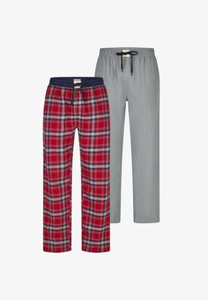 Červené kárované pyžamové kalhoty s tmavě modrým páskem a šedé pruhované pyžamové kalhoty s elastickým pasem. Obě mají šňůrky na zavazování.
