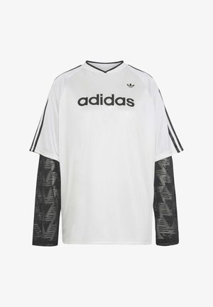 Camiseta blanca de manga larga de Adidas con mangas de malla negra, logotipo y texto de Adidas en negro en el pecho, y tres rayas negras en las mangas de los hombros.