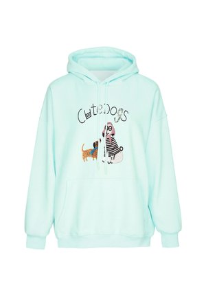 Lyseblå hættetrøje med forlomme, snore og broderet design af to hunde med teksten "Cute dogs" over dem.