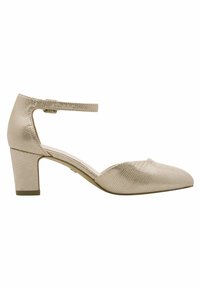 Beige ankelremssko med tekstureret materiale, der ligner slangeskind, en rund tå og en mellemhøj blokhæl. Glat indvendig foring.