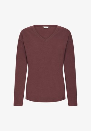 Długi rękaw bluzka w kolorze burgundowym z dekoltem w serek, wykonana z miękkiego materiału. Posiada luźny krój i gładką teksturę z lekko zaokrąglonym dołem.
