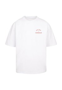 White cotton t-shirt with a relaxed fit. Features short sleeves and crew neckline. Text graphic in orange reads "FREE SPIRIT 2021 M.GONZALES."