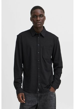 Schwarzes Langarmshirt aus Baumwolle, mit Button-Down-Kragen, Brusttasche und leicht lockerer Passform.