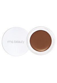 Crema RMS Beauty in un contenitore bianco rotondo. Il prodotto è di una tonalità marrone scuro con una texture liscia e lucida e un design minimal.