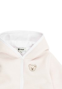 Helle rosa Fleece-Hoodie mit einem Teddybär-Applikation auf der linken Brust und einem weißen Reißverschluss, ausgestattet mit einem weichen Innenfutter für zusätzlichen Komfort.
