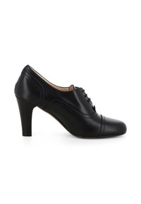 Scarpa nera in pelle con tacco, punta arrotondata, design con lacci e dettagli a cucitura curva. Presenta un tacco a spillo di altezza moderata.