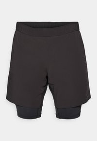 Svarte treningsshorts med elastisk midje, med et kortere ytterlag og et tettsittende innerlag, laget av lettvektig stoff.