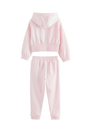 Ensemble de loungewear en coton rose clair comprenant un hoodie court avec un ourlet élastique et un pantalon fuselé assorti avec une taille élastique et des poignets élastiques.