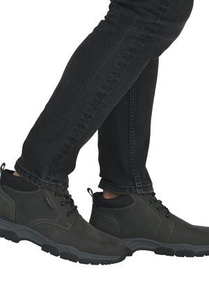 Men's ankle boots in dark gray suede with a textured finish, black padded collar, and rubber sole, featuring laces and stitching details.