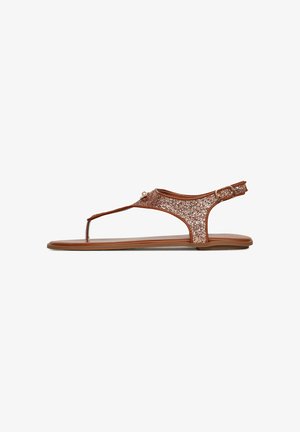 Sandalias planas de lentejuelas marrones con diseño de tira entre los dedos, correa ajustable en el tobillo, suela lisa y una silueta minimalista.