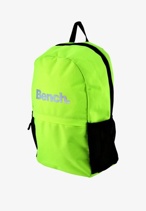 Neon green backpack with black accents and mesh side pockets; features a front zip pocket and silver brand logo. Rounded design.