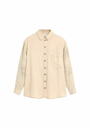 Bordinė ilgomis rankovėmis marškiniai smailiu apykakliu, priekyje krūtinės kišenė ir subtilūs horizontaliai siuvinėti detalės ant rankovių.