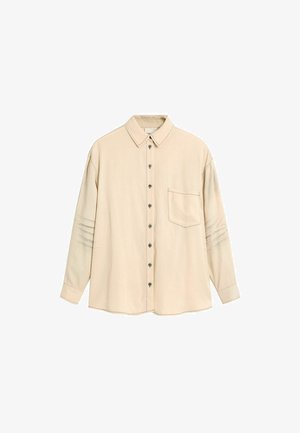 Beige väri pitkähihaisen nappisuljettavan paidan, jossa on terävä kaulus, rintatasku edessä ja hienovaraiset vaakasuorat ompelut hihansuissa.