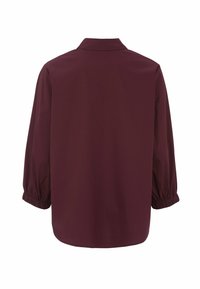 Bordeaux knoopshirt met kraag, elastische manchetten en een gladde stoftextuur. De achterkant toont een afgeronde zoom.