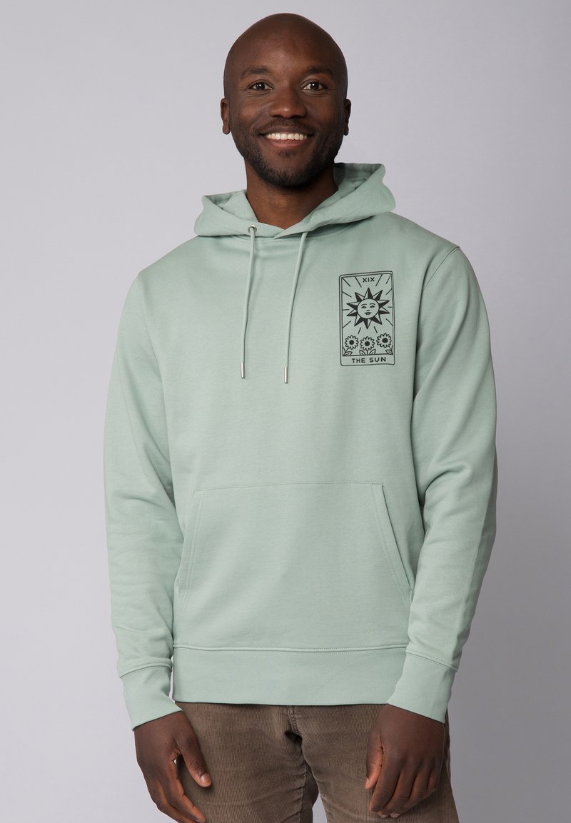 Mintgroene hoodie met een voorzak, voorzien van een zwart grafisch ontwerp van de zon. Eenvoudig, zacht materiaal met trekkoorden.