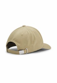 Khaki baseball cap made of textured cotton with a curved brim, adjustable fabric strap, and silver metal hardware detailing.