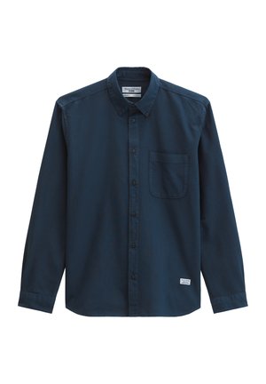 Donkerblauw overhemd met lange mouwen, knoopsluiting, voorzak op de borst en een kraag met knopen.