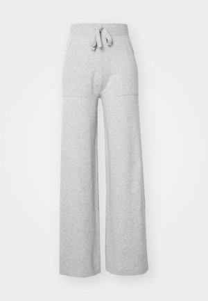 Grijze wijde sweatpants gemaakt van zachte stof, met een elastische tailleband, trekkoord en twee zijzakken. Glad texuur, casual ontwerp.