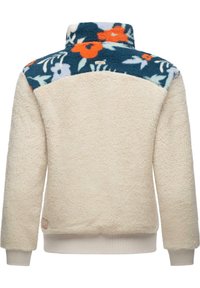 Pullover en polaire avec un corps beige et un motif floral coloré sur le col. Texture douce, col haut, et ourlet et poignets côtelés.