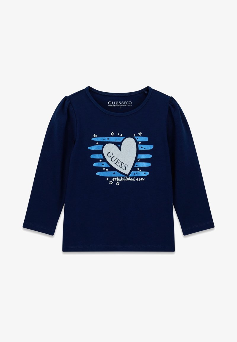 Camiseta de manga larga azul marino hecha de algodón orgánico con hombros abullonados, que presenta un corazón y la impresión "GUESS" en azul claro y plata, acentuada con estrellas.