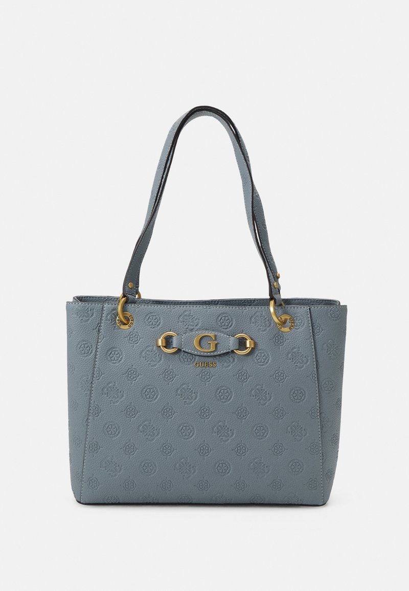 Sac cabas en cuir bleu embossé avec double poignée, ferrures dorées et détail du logo "G" central de Guess.