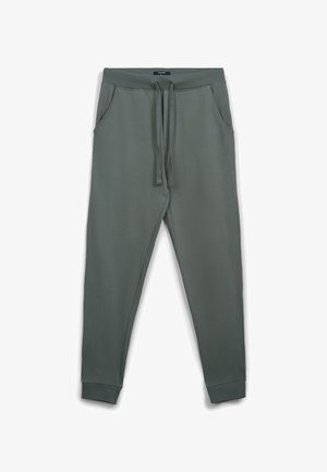 Pantaloni della tuta verde scuro realizzati in tessuto morbido, con fascia elastica in vita e coulisse, tasche laterali e polsini affusolati.