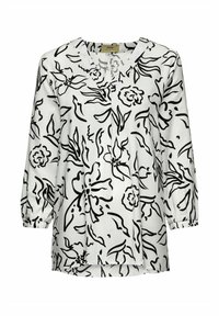 Czarna i biała bluzka w kwiatowy wzór z rękawami o długości trzech czwartych, dekoltem w kształcie litery V i elastycznymi mankietami. Luźny krój z zaokrąglonym dołem.
