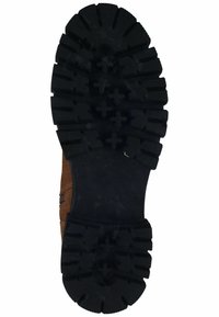 Botte de randonnée en daim marron avec une semelle en caoutchouc noire dotée de crampons profonds et de motifs croisés pour une meilleure adhérence. Fermeture éclair latérale pour un accès facile.