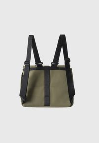 Olive green bag with black straps. Features a rectangular shape and a contrasting vertical band. Smooth texture, minimalistic design.
