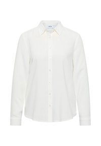 Chemise blanche à manches longues en tissu lisse. Dotée d'un col classique, d'une patte de boutonnage à l'avant et de manches à poignets.