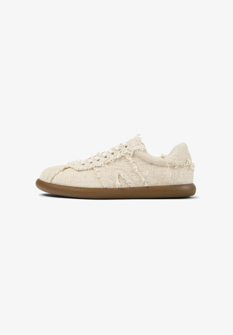 Beige textile sneakers with frayed edges, round toe, brown rubber sole, and lace-up closure featuring five eyelets. Textured fabric surface.