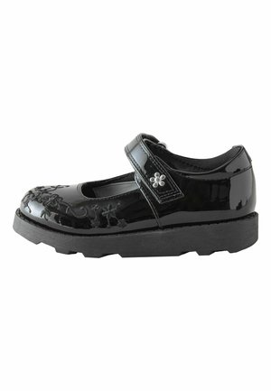 Scarpa Mary Jane nera lucida con ricamo floreale, cinturino a strappo, interno imbottito e suola spessa e strutturata per una migliore aderenza.