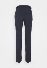 Marineblauwe, elastische wandelbroek met een slim fit, ritsopeningen op de benen en meerdere zakken voor opslag. Glad, lichtgewicht textuur.