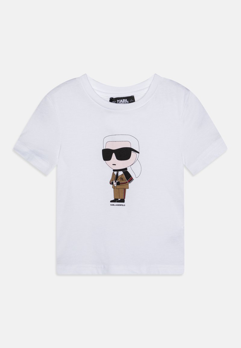 Balts īsām piedurknēm t-krekls ar karikatūras grafiku, kurā attēlots tēls brilles un brūnā mētē, ar melniem akcentiem un zīmola etiķeti.