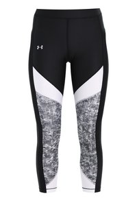 Svart- och vitmönstrade träningstights med en strukturerad grå panel och en vit detalj fram. Tillverkade av elastiskt material för optimal komfort.