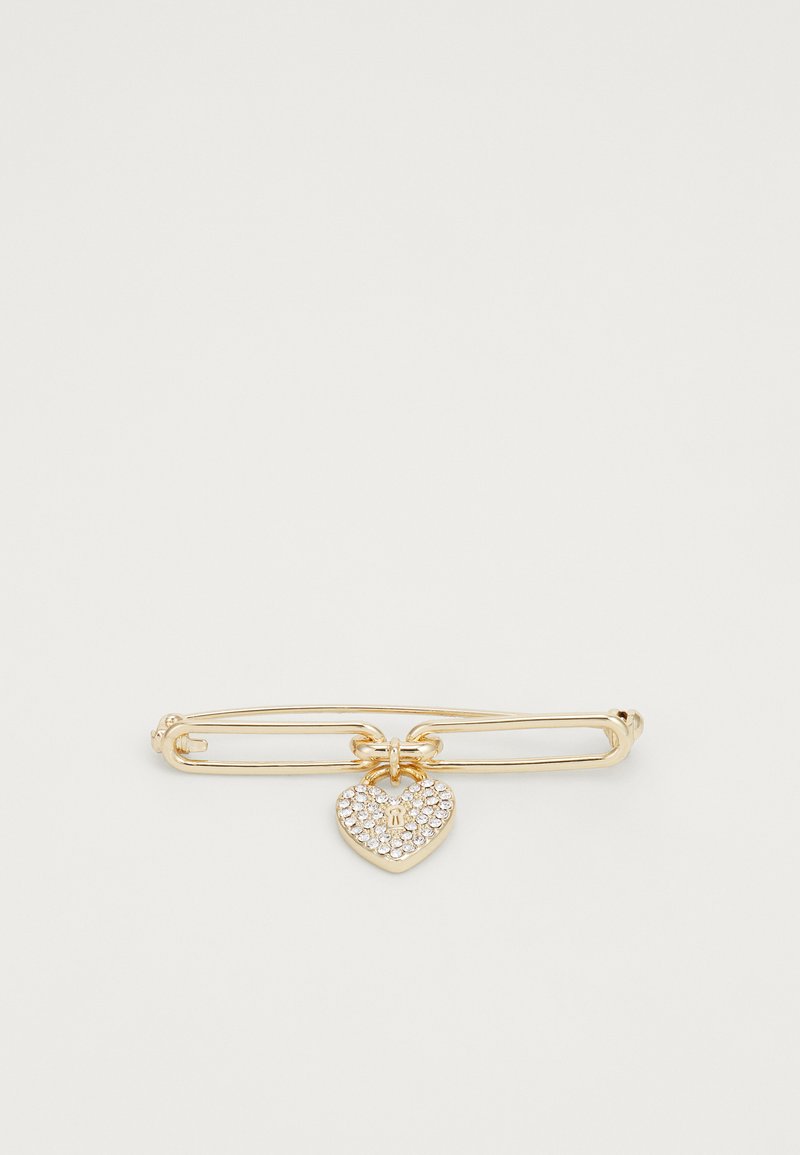 Gold safety pin brooch with a heart-shaped charm, embellished with clear rhinestones and featuring a small letter "R" detail.