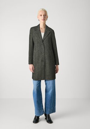 Gray wool-blend coat with a notched lapel, two-button closure, and side pockets, paired with wide-leg denim jeans and black ankle boots.