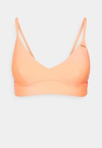 Bralette laranja claro com decote em V profundo, alças finas ajustáveis, textura suave e faixa inferior estreita. Design minimalista sem fechos.