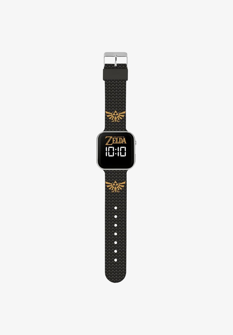 Montre numérique avec un cadran carré noir, affichage numérique blanc de l'heure, texte doré "Zelda" et un bracelet noir texturé avec un emblème doré.