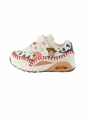Children’s sneaker with cow print, red stitching, and Woody character from Toy Story on the side, featuring velcro strap closure.