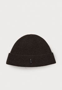 Brown knitted beanie with a folded ribbed brim, featuring a small black label at the front. The texture is soft and warm.