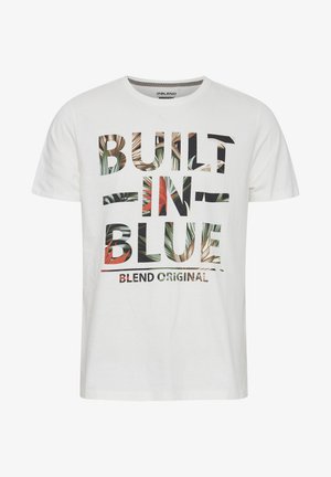 White cotton T-shirt featuring bold text "BUILT IN BLUE" with a floral pattern overlay. Short sleeves, crew neck, and relaxed fit.
