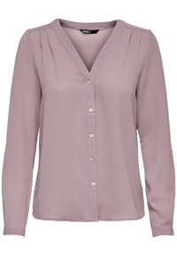 Blusa a maniche lunghe in tessuto mauve chiaro con scollo a V, chiusura con bottoni e sottili pieghe sulle spalle. Finitura morbida e texturizzata.