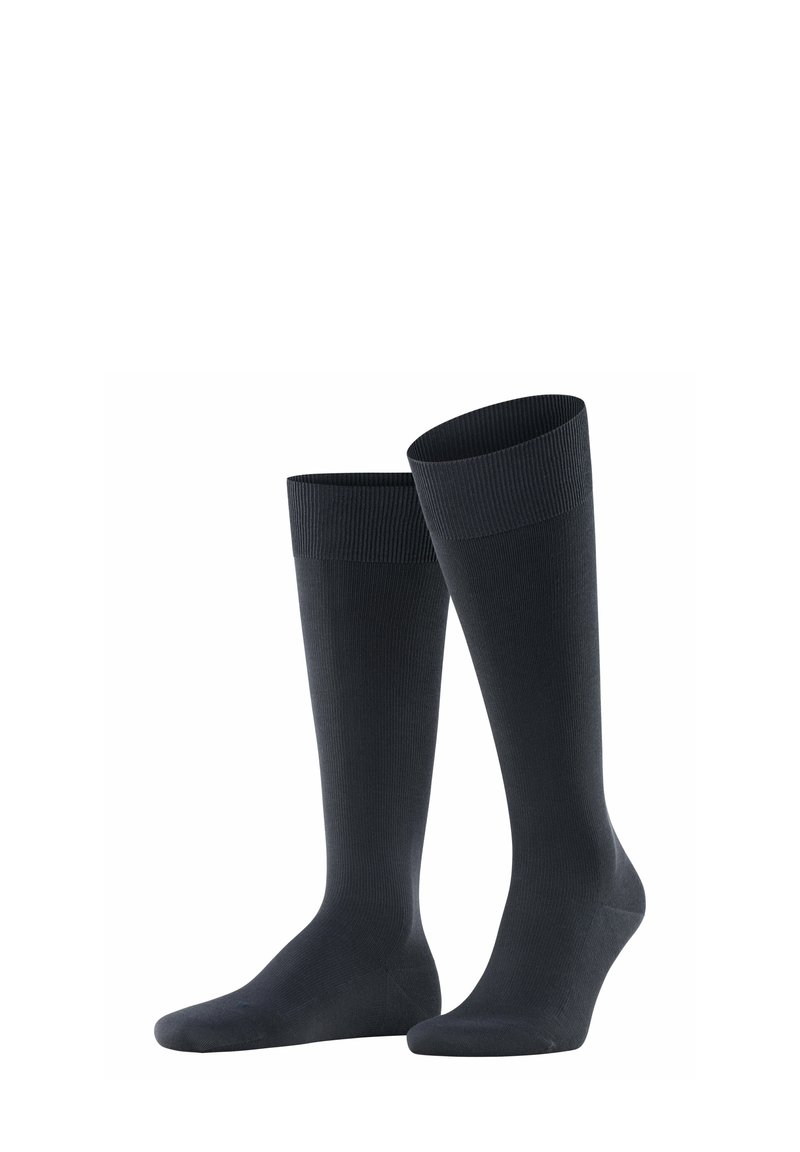 Calze nere fino al ginocchio realizzate in materiale liscio, con una parte superiore a coste per il comfort. Colore uniforme senza motivi o accessori.