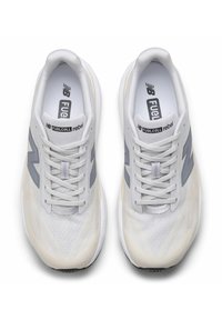 Gray and white running shoes with a mesh upper, featuring a textured side design, laces, and a cushioned sole. "Fuelcell rebel" branding visible.