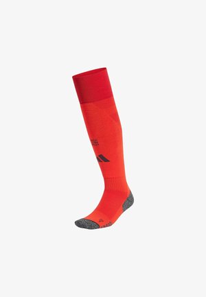 Calcetín rojo hasta la rodilla con parte superior texturizada, puntera reforzada en gris oscuro y gráficos con un logotipo. Fabricado con material elástico y transpirable.