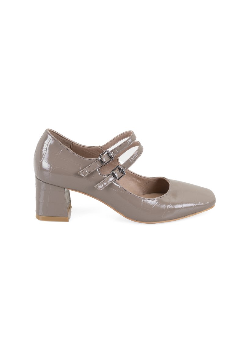 Beige Lackleder Mary Jane Absatzschuhe mit quadratischer Zehenpartie, zwei verstellbaren Riemen mit Schnallen und einem strukturierten Blockabsatz.