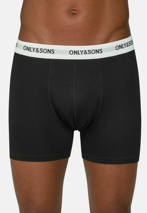 Schwarze Boxershorts aus elastischem Stoff, mit weißem Taillenbund und "ONLY&SONS"-Logo. Einfaches Design, enganliegende Passform und glatte Textur.