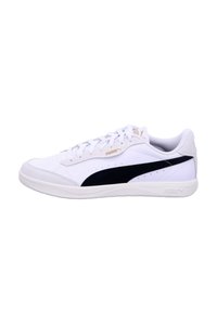 White low-top Puma sneaker with black side stripe, lace-up closure, and rubber sole, shown from the outer side on a white background.