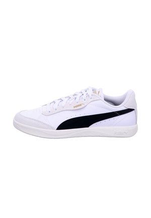 White low-top Puma sneaker with black side stripe, lace-up closure, and rubber sole, shown from the outer side on a white background.